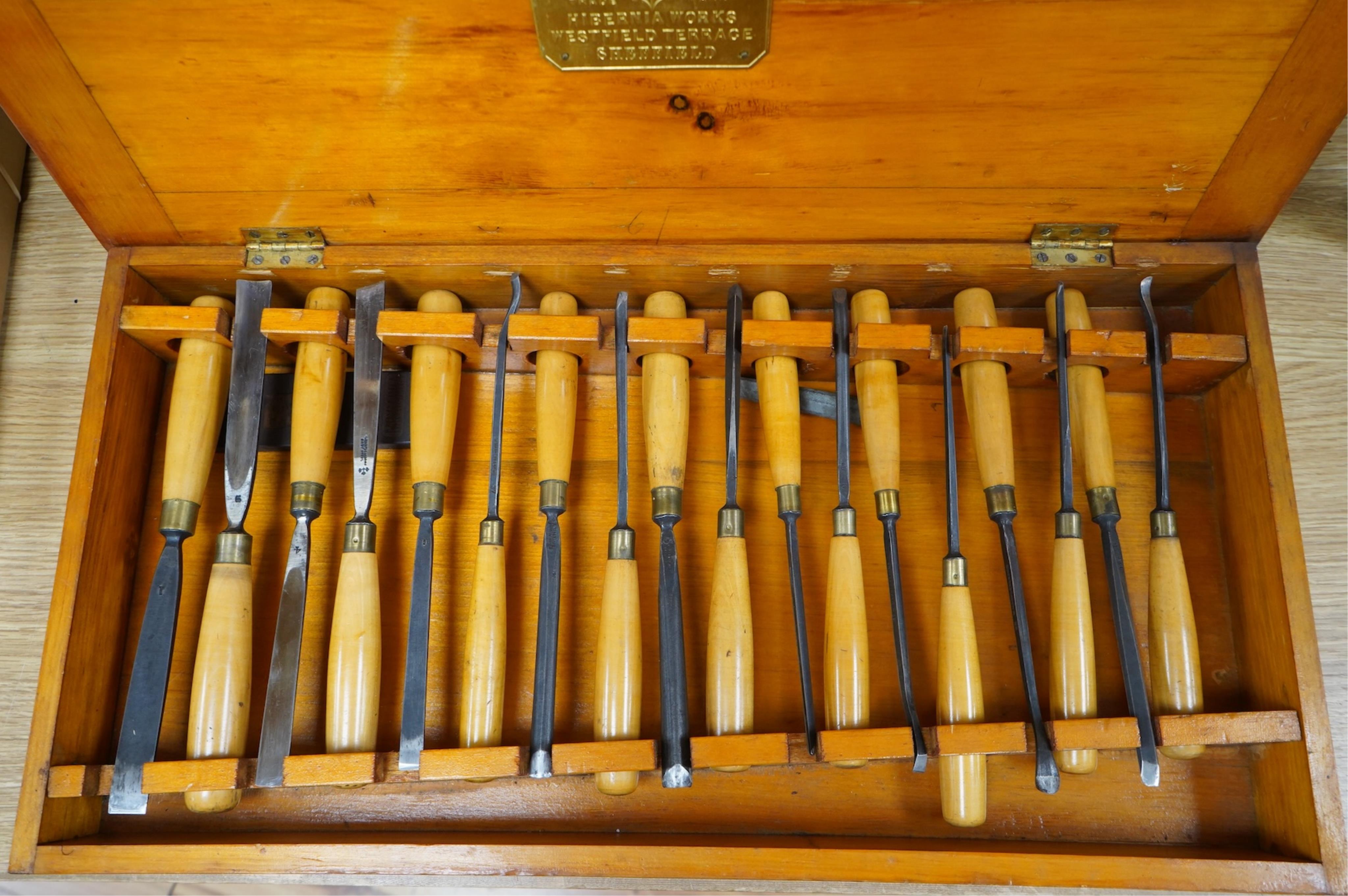 An 18-piece Marples wood carving chisel set, contained within the original fitted pine case with original Marples label to the inside of the lid
